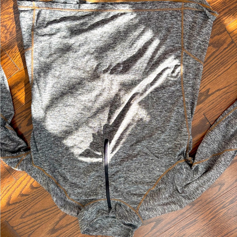 Large oversized athletic quarter zip with thin holes and back pocket